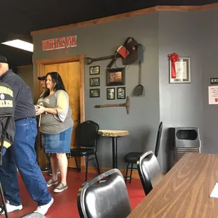 a group of people standing around a table