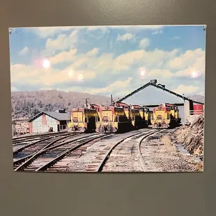 a train yard with a coaling station in the background