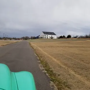 a green car parked on the road