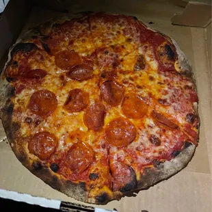 a pepperoni pizza in a box