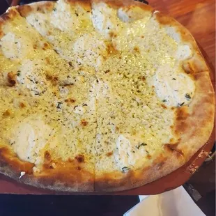 a pizza with cheese and olives