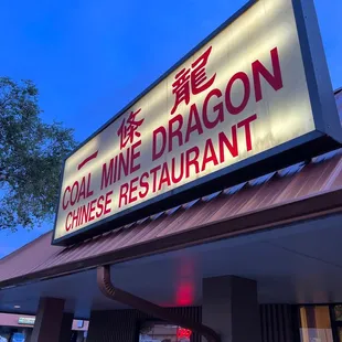a man standing in front of the restaurant