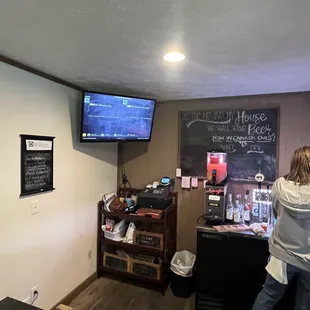 a man standing in front of the bar
