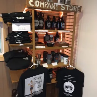 a display of beer bottles and t - shirts