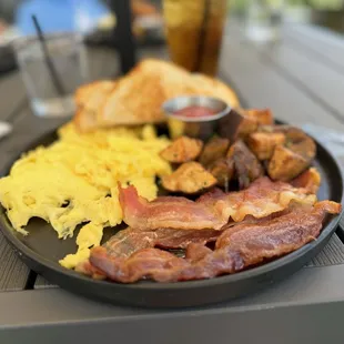 Egg Platter with bacon, sour dough bread and amazing hash potatoes.