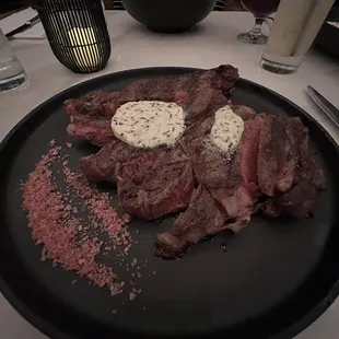 GRILLED 18 OZ. C.A.B. BONE-IN COWBOY RIBEYE WITH TRUFFLE HERB COMPOUND BUTTER