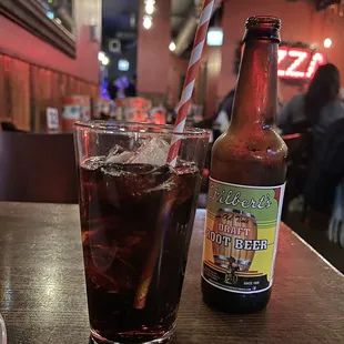 a bottle of beer and a glass on a table