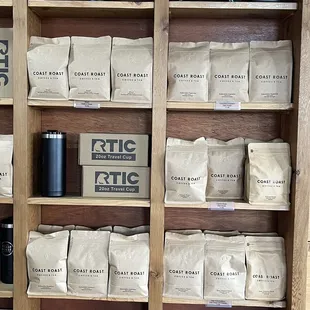 a shelf full of coffee bags