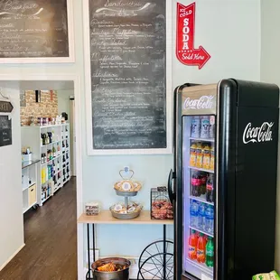 a kitchen with a chalkboard menu on the wall
