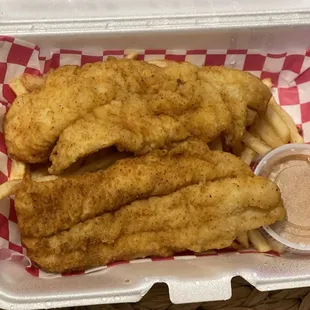 Fish plate with fries and secret sauce. Sauce is not spicy but it's really good. 2 pieces of fish and fries $12.00