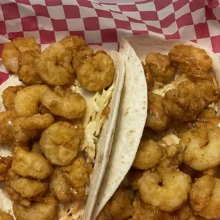 Two shrimp tacos with slaw and sauce on it not sure what kind of sauce but really good. $15.00. Very much fulfilling!