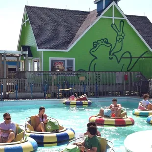  group of people riding in bumper boats