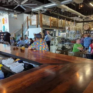 a large group of people sitting at a bar