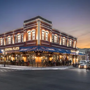 the exterior of a restaurant at dusk