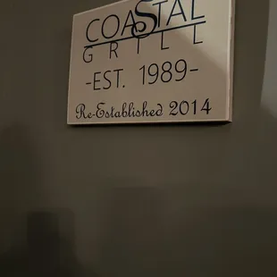 a sign on the wall of a restaurant