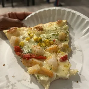 "Coastal pie" pizza slice