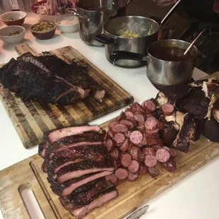 a variety of meats on a cutting board