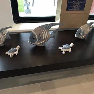 Angel fish $28 and Turtles $14 carved wood .