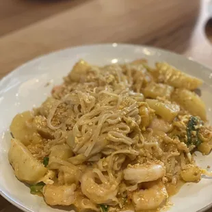 a plate of noodles and shrimp