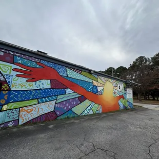 a colorful mural on the side of a building