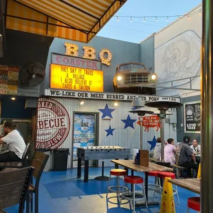 people sitting at tables outside