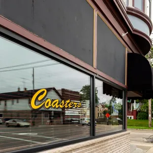 the reflection of a restaurant across the street