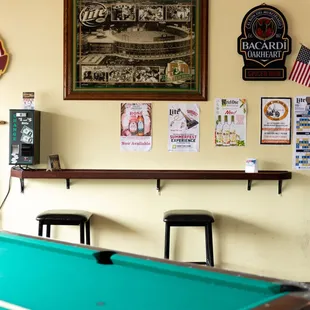 a pool table with a green cloth