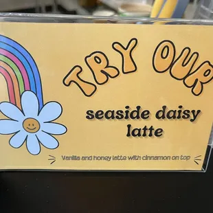 a sign that says, try one seaside daisy latte