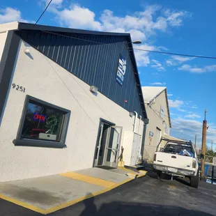 a truck parked in front of a building