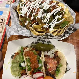 Loaded nachos and 3x tacos  (chicken, Asada, pastor). $24.