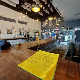 a bar with a menu on the counter