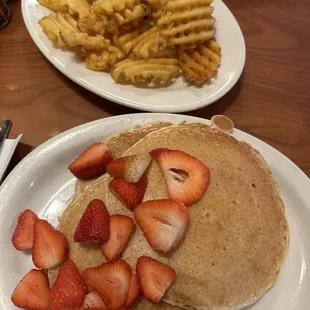 Pancakes with strawberries and waffle fries!