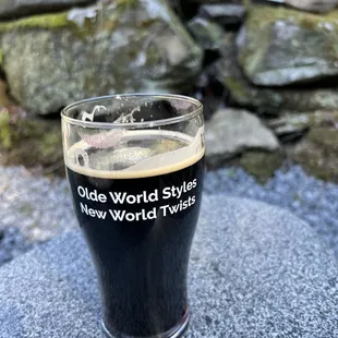 a pint of dark beer
