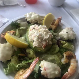 a plate of salad with shrimp