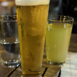 two glasses of beer on a table