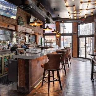 a bar with a lot of stools