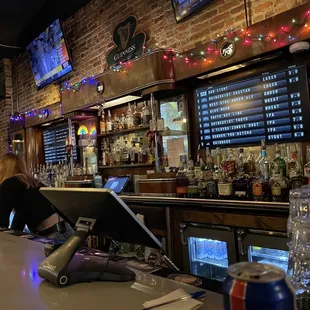 a woman working at a bar