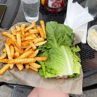 a sandwich with lettuce and fries