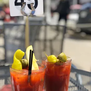 two bloody drinks on a table