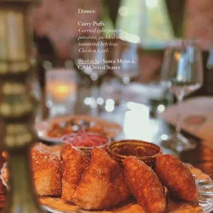 Curry Puffs - Curried split peas de potatoes, pickled onio tamarind ketchup