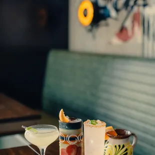 two cocktails on a table