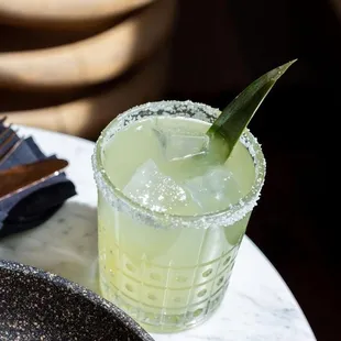 a margarita with a lime garnish