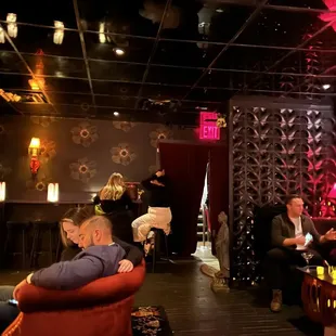 a group of people sitting in a lounge area