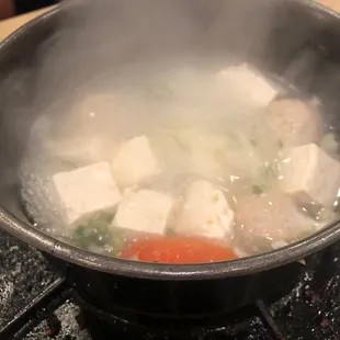 a steaming pot of food