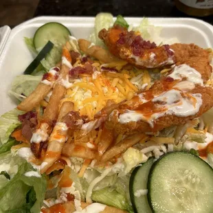 a salad in a styrofoam container