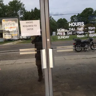 a motorcycle parked in front of a restaurant
