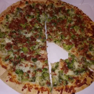 a half eaten pizza in a box