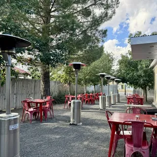 a patio with tables and umbrellas