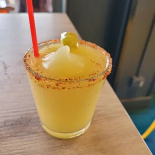 a margarita with a lime garnish