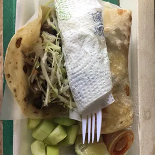 Street taco and Carne Asada burrito from Taco Pepe&apos;s stand.